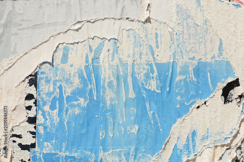 Old paper posters wall background. Creased crumpled paper placard, light blue, white, black colors