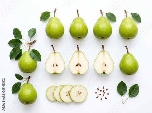 Top-down view of identical, fresh green pears arranged symmetrically on a clean white surface, highlighting natural repetition.