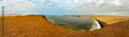 Peru, South America: breathtaking aerial and panoramic view of Playa Roja (Red Beach), one of the most famous beaches in the Paracas National Reserve, seen from the Mirador Istmo II viewpoint