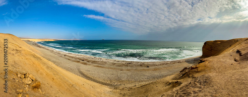 Peru, South America: breathtaking aerial and panoramic view of Playa Supay, one of the most famous beaches in the Paracas National Reserve, a protected natural area on the southern coast 