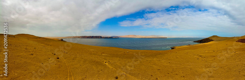 Peru, South America: breathtaking aerial and panoramic view of Playa Lagunilla de las Algas, one of the most famous beaches in Paracas National Reserve, protected natural area on the southern coast