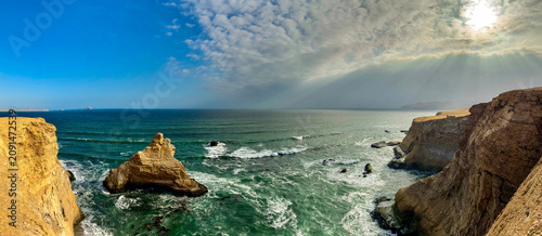 Peru, South America: breathtaking aerial and panoramic view of La Catedral (The Cathedral), one of the most iconic natural rock formations in the Paracas National Reserve, whose arch collapsed in 2007