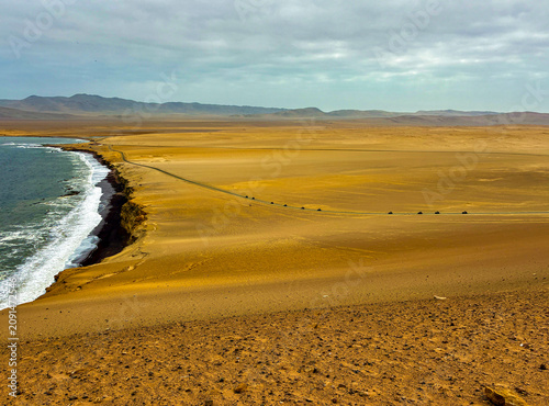 Peru, South America: breathtaking aerial and panoramic view of Playa Roja (Red Beach), one of the most famous beaches in the Paracas National Reserve, seen from the Mirador Istmo II viewpoint