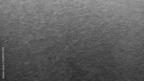 dark gray heather cotton fabric texture creates a minimalist abstract background for sustainable fashion design