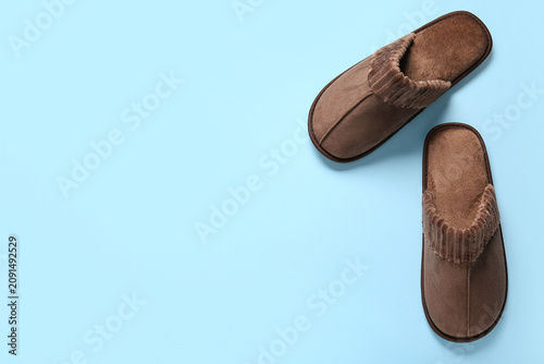Soft brown slippers on blue...