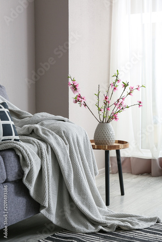 Vase with pink blooming bra...