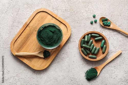 Bowls of spirulina powder a...
