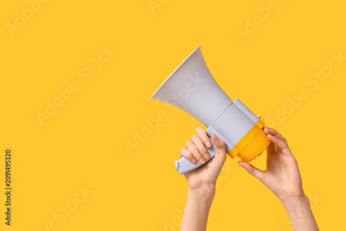 Female hands with megaphone...