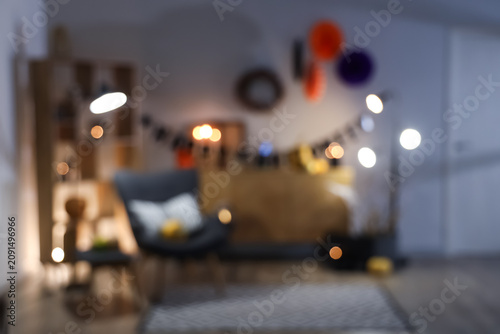Bild auf Leinwand Interior of festive living room with armchair, commode and Halloween decorations
