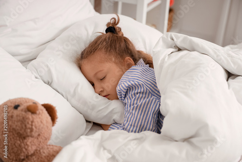 Cute little girl with toy b...