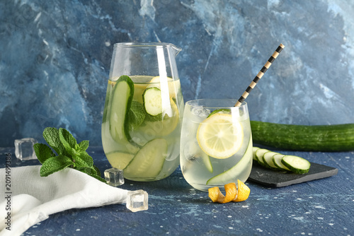 Glass and jug of lemonade w...