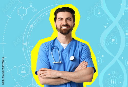 Smiling male doctor in blue...
