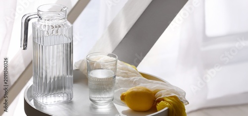 Glass pitcher and drinking ...