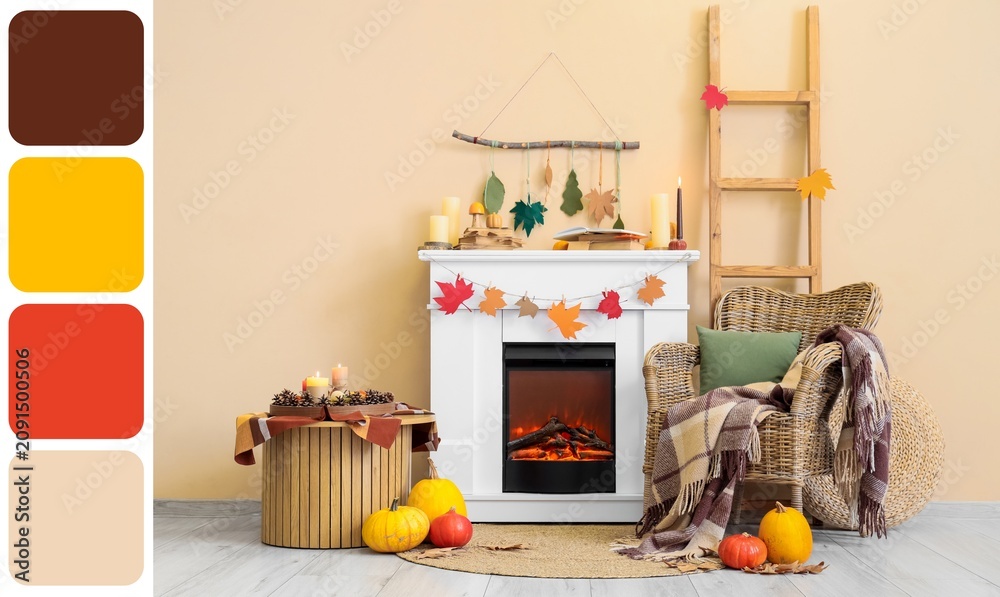 Fototapeta premium Cozy autumn living room interior with fireplace wicker chair pumpkins and fall decorations warm seasonal home decoration