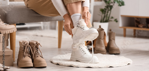 Woman trying on new white w...