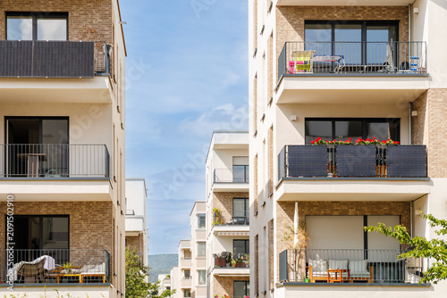 Canvas Print Modern apartment buildings with balconies in a city setting during daytime