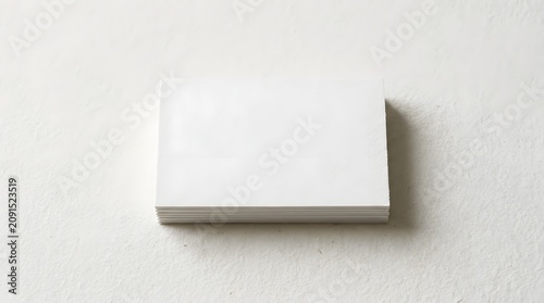 Blank White Business Card Stack Mockup on Textured Surface
