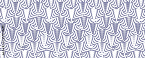 Seamless Japanese wave pattern in blue and white, inspired by traditional Seigaiha design, perfect for textiles, backgrounds, and decorative projects