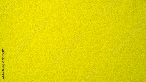 Vibrant yellow felt texture background for craft and design