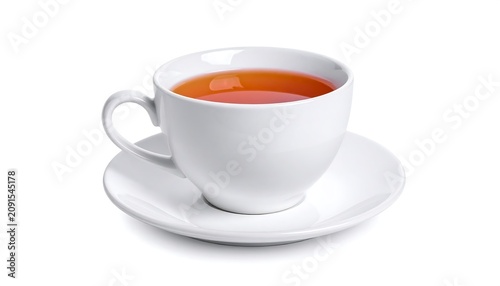A white teacup filled with amber liquid sits on its saucer, all against a bright white background, creating a clean, minimalistic aesthetic