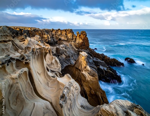 Wind Eroded Coastal Rock Formations Overlooking the Blue Ocean