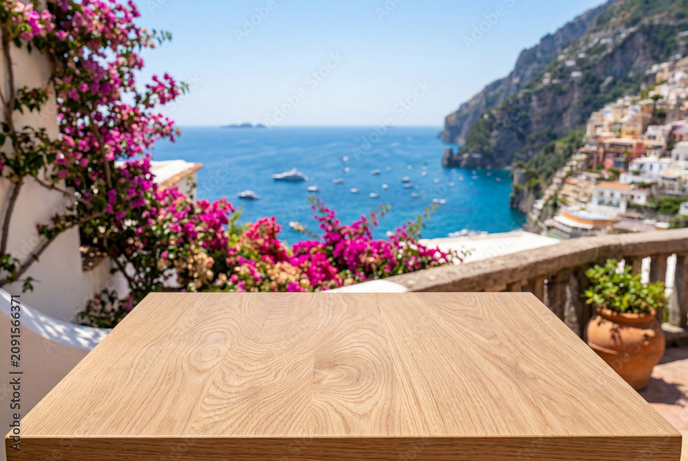 Fototapeta premium Empty wooden table overlooking a beautiful coastal summer town