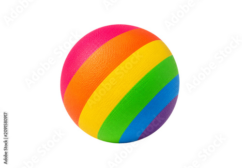 Bright rainbow-colored rubber ball isolated on a black background. Colorful striped play ball for children, outdoor games, sports, recreation, and active lifestyle. 