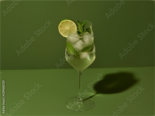 Hugo Spritz Cocktail on Green Background
