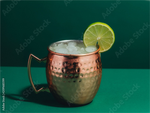 Moscow Mule in Copper Mug on Green Background