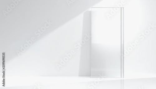 Clean white interior with a vertical glass partition and soft, angled sunlight