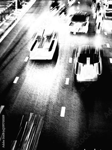 Black and White Aerial View of Traffic Road with Speeding Cars, High Contrast Motion Blur Street Photography