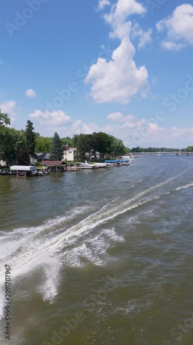 Overhead Vertical View Of Boat Speeding Down Summer River