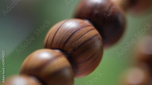 Wooden prayer beads on a string macro shot