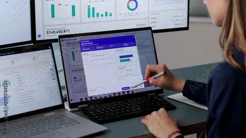 Treasury Manager Reviews Real-time Cash Dashboard On Laptop