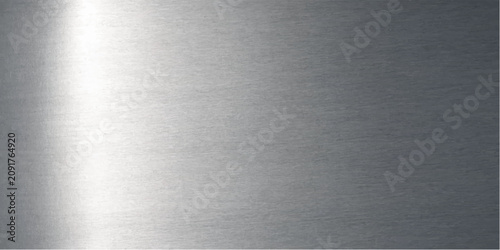 A brushed metal surface with a strong highlight on the left, suggesting industrial or technological application.