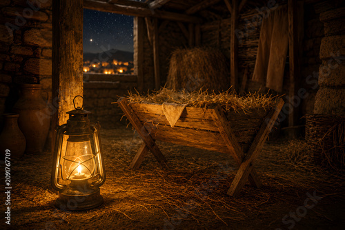 A scene of an empty manger, a bright star at sky with a concept of nativity and Christianity
