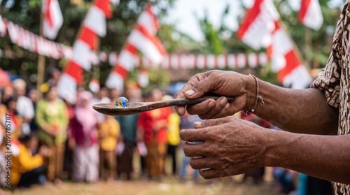 Traditional Indonesian Independence Day game of balancing a marble on a spoon.