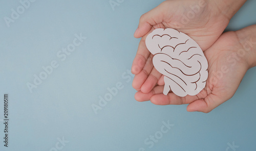 Quadro su tela Gentle hands hold paper brain symbol with hope demonstrating inclusive medical c