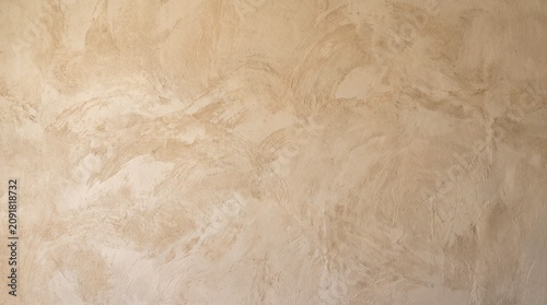 Elegant Beige Venetian Plaster Wall Texture with Subtle Artistic Swirls and Soft Neutral Earth Tones for Contemporary Interior Background Design