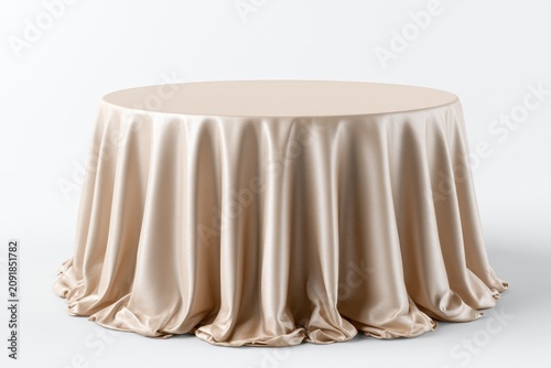 Champagne silk tablecloth draped over a round table in a minimalist studio setting with soft lighting for event planning and luxury hospitality branding