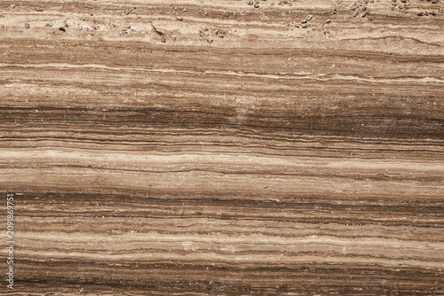 close up shot of brown or beige cross cut travertine marble stone texture background