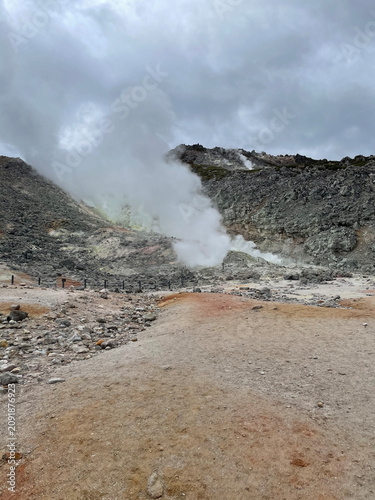 Canvastavla Volcanic Steam Rising from Geothermal Terrain Under Cloudy Sky