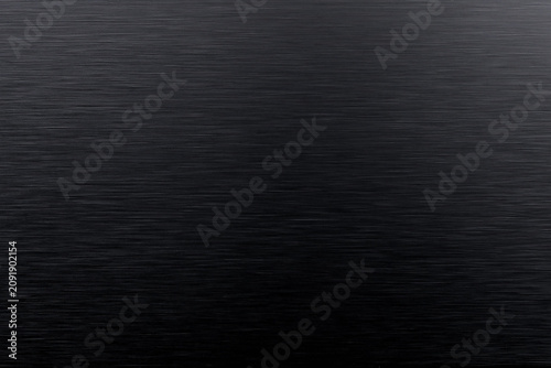 Horizontal brushed black metal surface with gradient illumination