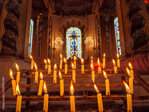 votive candles in front of a window with a cross, Saint Paul's Cathedral, London, England, Great Britain, Europe