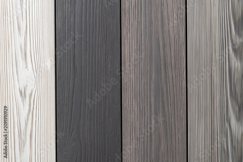 Assorted vertical wood planks in shades of grey and white