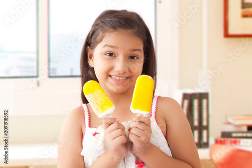 Girl eating ice cream popsickles