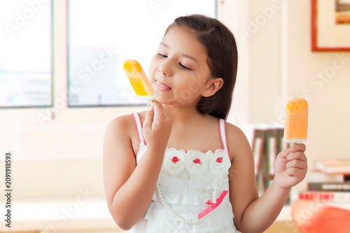 Girl eating ice cream popsickles