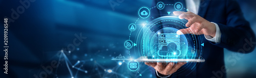 Картината върху платно Hosting engineer using tab analysing Web Hosting and server infrastructure systems, website deployment management, cloud hosting solutions and uptime performance monitoring