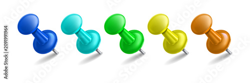 Photos Five colorful plastic push pins arranged in a horizontal row with soft shadows o
