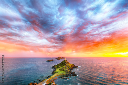 Fotografie Amazing sunset over Torra di a Parata with Genoese Tower and Archipelago of Sanguinaires islands at background